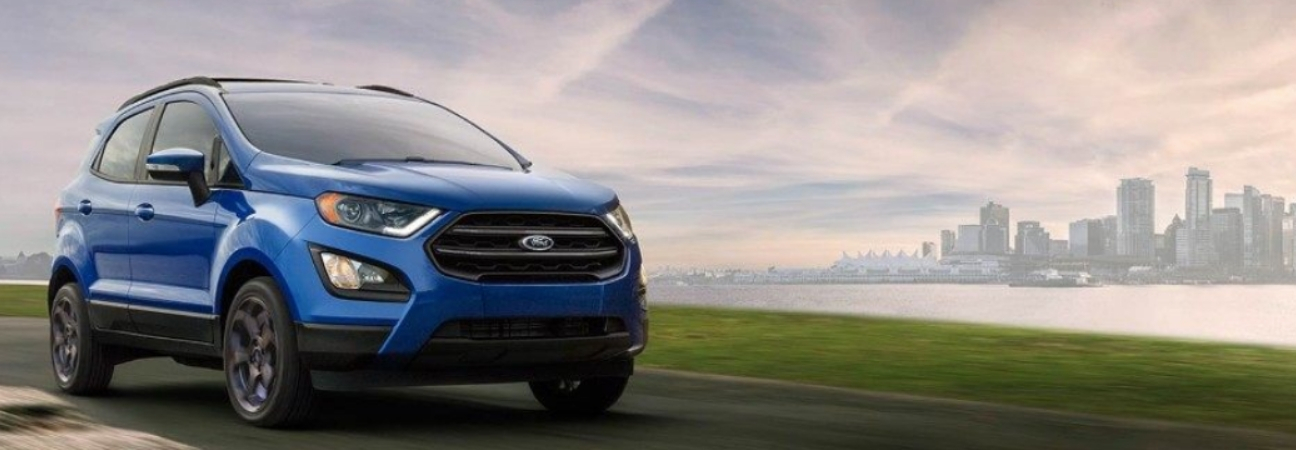 Blue 2018 Ford EcoSport in the foreground of a city